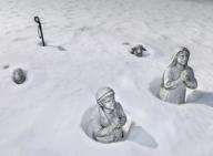 Holliston, Massachusetts USA March 16, 2015 Snow surrounds statues at Our Lady of Fatima Shrine. These statues face a statue of the Virgin Mary (off camera). A record setting snowfall fell during this winter. Chris Fitzgerald / Candidate Photos