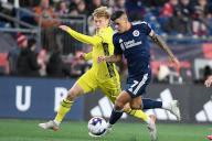 March 18, 2023: New England Revolution forward Gustavo Bou (7) and Nashville SC forward Jacob Shaffelburg (14) in game action during the first half in Foxborough Massachusetts. Eric Canha