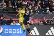 March 18, 2023: Nashville SC defender Daniel Lovitz (2) and New England Revolution midfielder Noel Buck (29) try to head the ball during the first half in Foxborough Massachusetts. Eric Canha