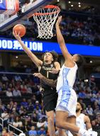 March 14, 2024: Florida State Seminoles Guard (1) Jalen Warley goes to the basket guarded by Carolina Tarheels Forward (5) Armando Bacot during an ACC Men