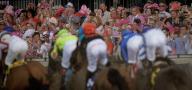 May 3, 2024, Louisville, Kentucky, USA: Fans Cheers as the field for the Longines Kentucky Oaks races into the first turn at Churchill Downs in Louisville, Kentucky on May 3, 2024. Alex Evers\/Eclipse Sportswire\/CSM(Credit Image: Â Alex Evers\/Cal Sport Media
