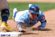 May 8, 2024: Kansas City Royals catcher Freddy Fermin (34) slides safely back to first base during the seventh inning of a game against the Milwaukee Brewers at Kauffman Stadium in Kansas City, MO. David Smith\/CSM (Credit Image: Â David Smith\/Cal Sport Media