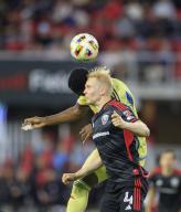 May 15, 2024: D.C. United Defender (4) Matti Peltola goes up for a header against New York Red Bulls Defender (4) Andres Reyes during an MLS soccer match between the D.C. United and the New York Red Bulls at Audi Field in Washington DC. Justin Cooper\/CSM (Credit Image: Â Justin Cooper\/Cal Sport Media