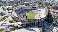 An aerial view of Neyland Stadium reveals a massive, iconic structure nestled by the Tennessee River, with its distinctive bowl shape and seating for over 100,000 fans, showcasing its rich football heritage.(Credit Image: Â Walter G Arce Sr Grindstone Medi\/Cal Sport Media