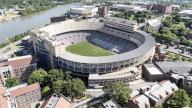An aerial view of Neyland Stadium reveals a massive, iconic structure nestled by the Tennessee River, with its distinctive bowl shape and seating for over 100,000 fans, showcasing its rich football heritage.(Credit Image: Â Walter G Arce Sr Grindstone Medi\/Cal Sport Media