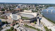 An aerial view of Neyland Stadium reveals a massive, iconic structure nestled by the Tennessee River, with its distinctive bowl shape and seating for over 100,000 fans, showcasing its rich football heritage.(Credit Image: Â Walter G Arce Sr Grindstone Medi/Cal Sport Media