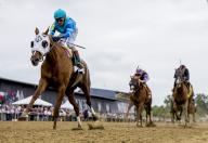 May 18, 2024, Baltimore, Md, USA: Gun Song (5), ridden by John Velazquez, wins the Black-Eyed Stakes on Black-Eyed Susan Stakes Day at Pimlico Race Course in Baltimore, Maryland on May 17, 2024. Alex Evers/Eclipse Sportswire/CSM(Credit Image: Alex Evers/Cal Sport Media