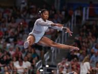 June 2, 2024: Jordan Chiles leaps above the balance beam mduring the Woman