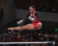 June 2, 2024: Sunisa Lee flies above the bars during the Woman