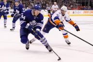 December 29, 2015: New York Islanders Centre John Tavares (91) battles for the puck against Toronto Maple Leafs Defenceman Morgan Rielly (44) during the first period at the Air Canada Centre in Toronto, ON. (Photo by: Kevin Sousa/CSM)