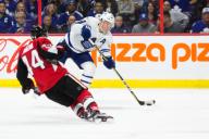 October 21, 2017: Toronto Maple Leafs Morgan Rielly (44) readies to shoot while Ottawa Senators Jean-Gabriel Pageau (44) slides attempting to block the shot during the game between Toronto Maple Leafs and Ottawa Senators at Canadian Tire Centre in ...