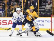 March 22, 2018; Nashville TN, USA Toronto Maple Leafs defenseman Morgan Rielly (44) and Nashville Predators center Colton Sissons (10) fight for position during the second period between the Toronto Maple Leafs vs the Nashville Predators at Bridgestone Arena. (Mandatory Photo Credit: Steve Roberts/CSM)