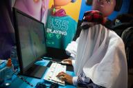 An attendee dressed as a ghost plays Epic Games Fortnite during the fourth day of the SOFA (Salon del Ocio y la Fantasia) 2021, a fair aimed to the geek audience in Colombia that mixes Cosplay, gaming, superhero and movie fans from across Colombia, in Bogota, Colombia on October 17, 2021