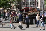 Members of the public watch a destroyed Russian T-72B tank, part of the Forum on European Culture 2023 at the Leidseplein on May 25, 2023 in Amsterdam,Netherlands. The 4th edition of this Forum focuses on the meaning and future of democracy in Europe. Since the aggressive and imperialistic war in Ukraine