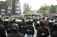 Dutch anti rio police stands near students and supporters pro-Palestinian block the street in front of the University of Amsterdam to protest against the ongoing conflict Israel and the Palestinian on May 13,2024 in Amsterdam,Netherlands