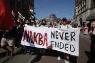 People take part during march protest to commemorate the 76th anniversary of the Nakba and against the ongoing conflict Israel and the Palestinian at the Dam Square on May 11, 2024 in Amsterdam,Netherlands. Nakba Day marks the anniversary of the some 700,000 Palestinians fled or were expelled on Israel
