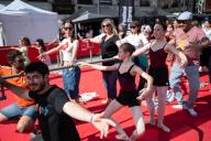 People trying ballet in Puerta del Sol during Madrid en Danza 2024 festival, Madrid