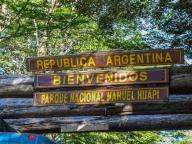 The sign for Naheul Huapi National Park at Paso Perez Rosales on the Chile - Argentina border near Lake Frias, Argentina