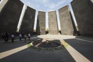 School children standing by the eternal flame dedicated to the 1.5 million people killed during the Armenian Genocide in the Armenian Genocide memorial complex on Tsitsernakaberd hill; Yerevan, Armenia