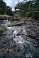 Hawaii, Hilo, Rainwater flows through Boiling Pots Park.