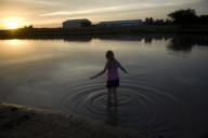 com.newscom.model.mediaobject.impl.MSMediaObject@22330952[tagId=depphotos263408,docId=34547681HighRes,ftSubject=Girl stands in a farm pond at sunset,rfrm=<null>]