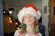 com.newscom.model.mediaobject.impl.MSMediaObject@4d4a5cfe[tagId=depphotos263439,docId=34549919HighRes,ftSubject=Girl plays with Christmas tree ornaments,rfrm=<null>]