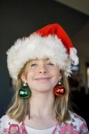 com.newscom.model.mediaobject.impl.MSMediaObject@a2d1f22[tagId=depphotos263440,docId=34549916HighRes,ftSubject=Girl plays with Christmas tree ornaments,rfrm=<null>]