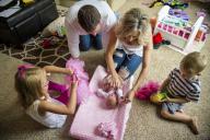 com.newscom.model.mediaobject.impl.MSMediaObject@7d203e44[tagId=depphotos265461,docId=34553381HighRes,ftSubject=Young family at home with a newborn baby girl,rfrm=<null>]