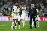 Vinicius Jr, Real Madrid head coach Carlo Ancelotti and Jude Bellingham of Real Madrid celebrate victory at full time of the La Liga match between Real Madrid and FC Barcelona played at Santiago Bernabeu Stadium on April 21 2024 in Madrid, Spain. (Photo by Cesar Cebolla / ALFAQUI