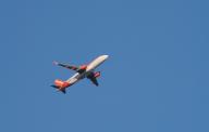 14 April 2024, Brandenburg, Loewenbruch: 14.04.2024, An Easyjet plane, coming from Schoenefeld, flies in the light of the evening sun in the sky over Loewenbruch in Brandenburg, south of Berlin. The British airline Easyjet is considered the second largest low-cost airline in Europe. Photo: Wolfram Steinberg\/dpa Photo: Wolfram Steinberg\/dpa