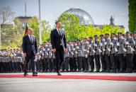29 April 2024, Berlin: Federal Chancellor Olaf Scholz (l, SPD) welcomes Milojko Spajic, Prime Minister of Montenegro, with military honors in front of the Federal Chancellery. Scholz and Spajic had met for bilateral talks. Photo: Michael Kappeler\/dpa