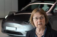 29 April 2024, Brandenburg, Grünheide (Mark): Ursula Nonnemacher (Alliance 90\/The Greens), Brandenburg\'s Minister for Social Affairs, Health, Integration and Consumer Protection, speaks during a press statement in the visitor lobby of the Tesla Gigafactory against the backdrop of a Tesla "Model Y". On the occasion of World Day for Workplace Health, the Minister met with the factory management, occupational health and safety officers and members of the works council. Photo: Soeren Stache\/dpa