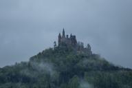 SYMBOL - 02 May 2024, Baden-Württemberg, Hechingen: Hohenzollern Castle in the Zollernalb district can be seen in rainy weather. Photo: Silas Stein\/dpa