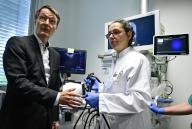 03 May 2024, Berlin: Federal Health Minister Karl Lauterbach (SPD) and the head of the endoscopy department, Kathleen Moeller, look at a screen in the endoscopy department during a demonstration of a device during a visit to the Sana Clinic. Photo: John Macdougall\/AFP POOL\/dpa