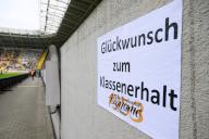 04 May 2024, Saxony, Dresden: Soccer: 3rd division, SG Dynamo Dresden - SC Verl, matchday 36, Rudolf-Harbig-Stadion. A poster saying "Congratulations on relegation" is stuck to the stands. Photo: Robert Michael\/dpa\/ZB