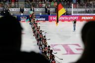 04 May 2024, Lower Saxony, Wolfsburg: Ice hockey: International match, Germany - France, EisArena Wolfsburg. The German national players stand next to each other during the anthem. Photo: Swen Pförtner\/dpa