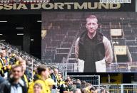 04 May 2024, North Rhine-Westphalia, Dortmund: Soccer: Bundesliga, Borussia Dortmund - FC Augsburg, Matchday 32, Signal Iduna Park. Dortmund\'s Marco Reus speaks in a video message from the scoreboard. He will leave the club at the end of the season. Photo: Bernd Thissen\/dpa - IMPORTANT NOTE: In accordance with the regulations of the DFL German Football League and the DFB German Football Association, it is prohibited to utilize or have utilized photographs taken in the stadium and\/or of the match in the form of sequential images and\/or video-like photo series