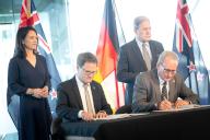 04 May 2024, New Zealand, Auckland: German Foreign Minister Annalena Baerbock (standing left) and her New Zealand counterpart Winston Peters (standing right) attend the signing of a memorandum of cooperation between the German Alfred Wegener Institute, represented by Markus Rex (seated left), head of the Department of Atmospheric Physics, and Peter Smith of the New Zealand Antarctic Institute (seated right). Photo: Sina Schuldt\/dpa