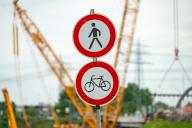 04 May 2024, Hamburg: Traffic signs indicate a closure for pedestrians and cyclists. Following the completion of the southern section of the Finkenwerder Bridge, demolition of the northern section has been underway since Friday evening, according to the HPA. Photo: Jonas Walzberg\/dpa