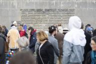05 May 2024, Lower Saxony, Lohheide: Visitors stand in front of an inscription wall on the grounds of the Bergen-Belsen Memorial after a commemorative event marking the 79th anniversary of the liberation of the former Bergen-Belsen concentration camp. In April 1945, British troops liberated the Bergen-Belsen concentration camp, where over 52,000 people died. Photo: Michael Matthey\/dpa