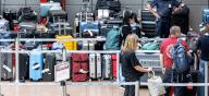 05 May 2024, Hamburg: Baggage is stored at a collection point in a departure hall at Hamburg Airport. Due to a breakdown in the baggage system, the baggage has to be sorted by hand and then taken to the aircraft. Photo: Markus Scholz\/dpa