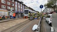 05 May 2024, North Rhine-Westphalia, Gelsenkirchen: Emergency services stand by a streetcar after a fatal accident involving a young boy. A seven-year-old boy was hit and fatally injured by a streetcar in Gelsenkirchen. The fire department was able to free him, but he died on the way to hospital. (to dpa "Seven-year-old run over by streetcar") Photo: Justin Brosch\/dpa
