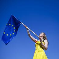 A woman poses with a European flag on the occasion of the 20th anniversary of Poland\'s accession to the EU, taken at a ceremony in Slubice. S\u0098Çubice, 01.05.2024 Slubice, 01.05.2024