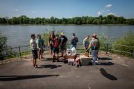 09 May 2024, North Rhine-Westphalia, Königswinter: Participants on a Father\'s Day tour stand by the Rhine. Photo: Christian Knieps\/dpa