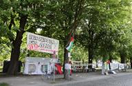 10 May 2024, Hamburg: Banners with various pro-Palestinian slogans can be seen at a vigil at Moorweide near Hamburg University. Photo: Christian Charisius/dpa