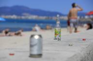 09 May 2024, Spain, Palma: Empty bottles and cans can be seen on Arenal beach. Photo: Clara Margais/dpa