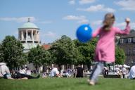 10 May 2024, Baden-Württemberg, Stuttgart: A child with a balloon runs across the Schlossplatz. Photo: Marijan Murat/dpa