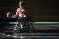 09 May 2024, Lower Saxony, Hanover: Professional wheelchair basketball player Vanessa Erskine dribbles a basketball after a game of her team Hannover United in the German Wheelchair Basketball League. Photo: Moritz Frankenberg/dpa