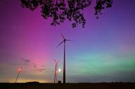 10 May 2024, Brandenburg, Sieversdorf: Light green and violet-reddish auroras glow in the night sky in the Oder-Spree district of East Brandenburg. The northern lights (aurora borealis) are produced by a cloud of electrically charged particles from a solar storm in the earth