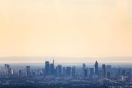 11 May 2024, Hesse, Königstein: The skyline of Frankfurt am Main presents itself in the early morning shortly after sunrise. Photo: Lando Hass/dpa